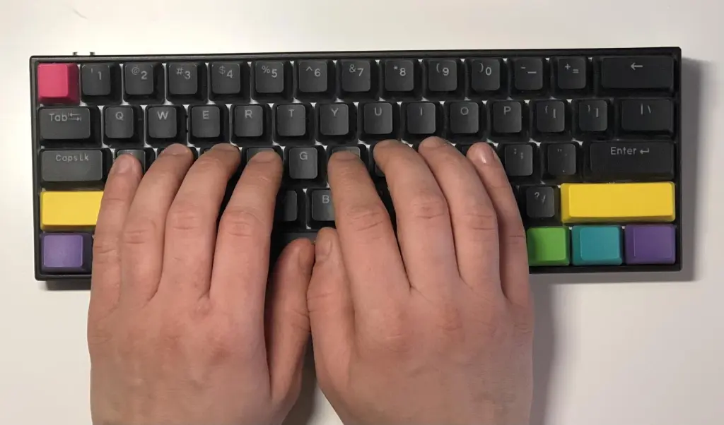 Hands typing on Anne Pro 2 mechanical keyboard