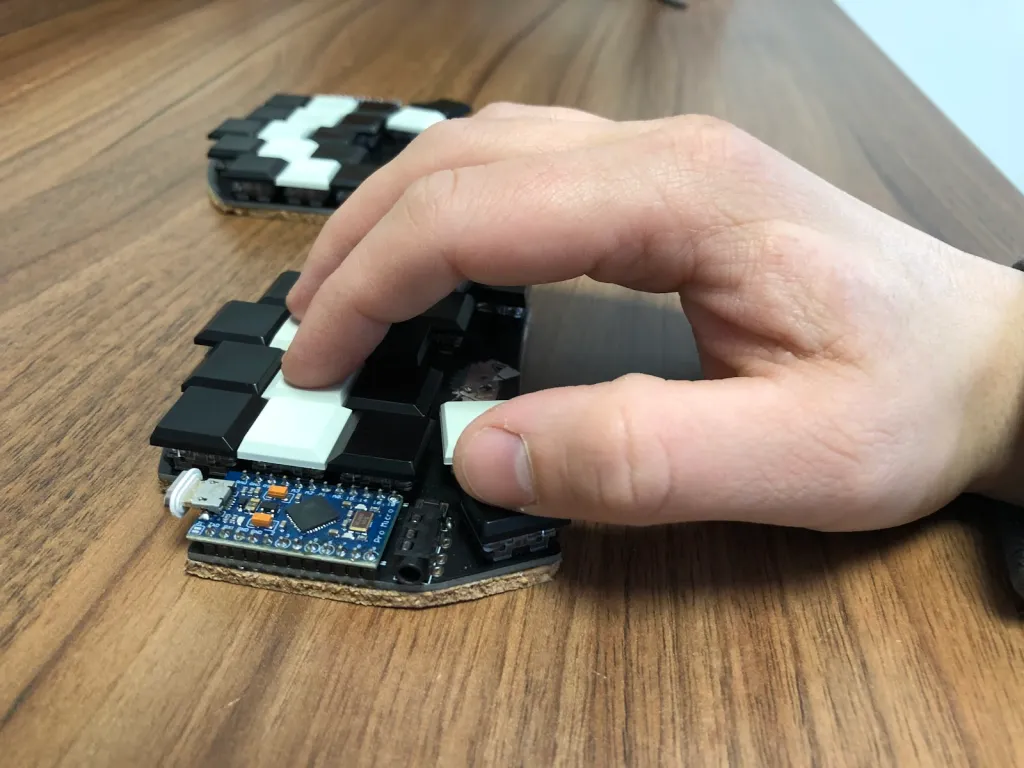 Hand typing on Ferris Sweep keyboard