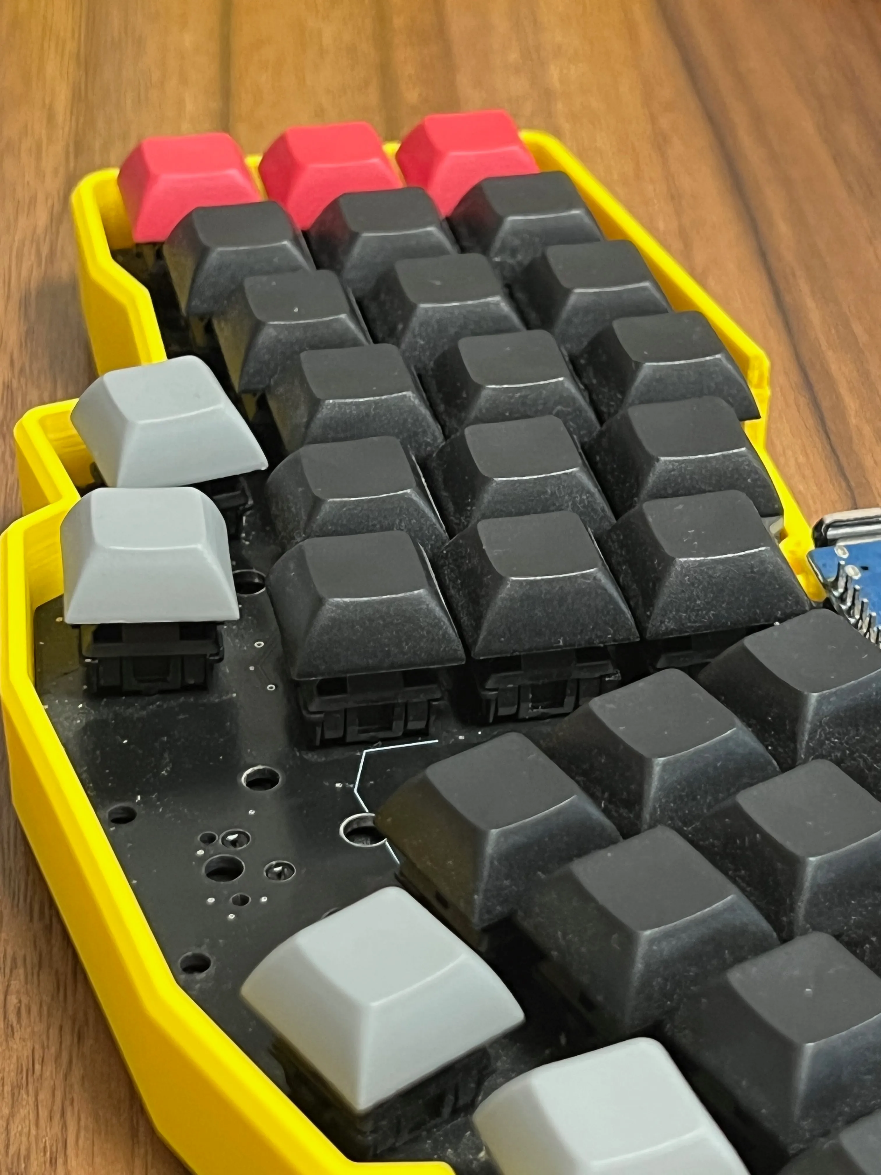 Side view of a Reviung41 switch seated directly on the PCB without a switch plate